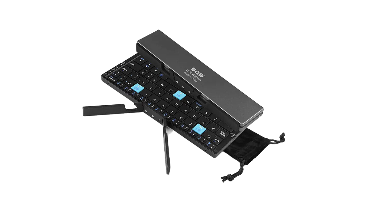 Compact foldable Bluetooth keyboard with durable aluminum design and magnetic stand on a tablet workstation.