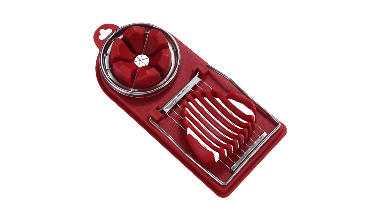 Stainless steel dual-blade egg cutter slicing a perfectly boiled egg on a tidy, mess-free kitchen counter.